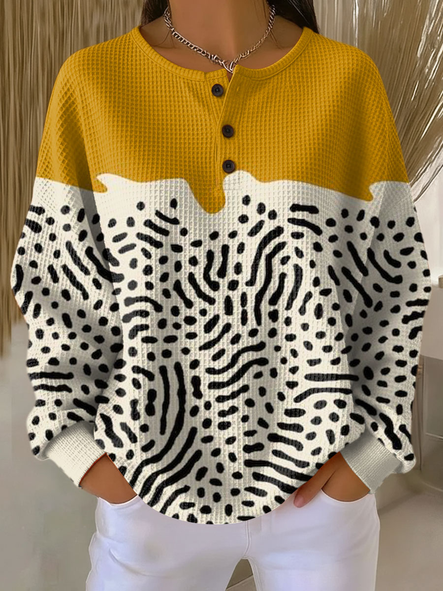 Women's waffle-knit jumper in mustard yellow with zebra-style dot print