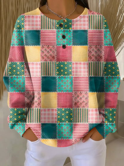 Women's waffle-knit jumper with colorful patchwork plaid and button placket
