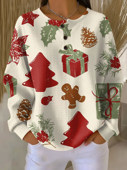 Women's cream knit jumper with colorful Christmas motifs: trees, gifts, gingerbread, candy