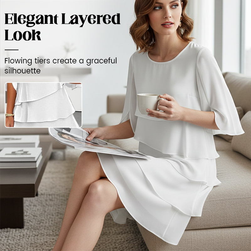 White tiered ruffle-sleeve dress with cape-like sleeves