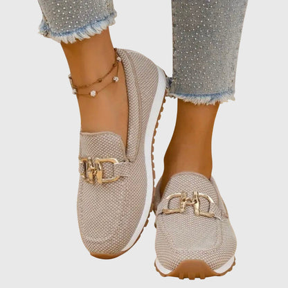Beige orthopedic mesh loafers with gold buckle detail and textured outsole