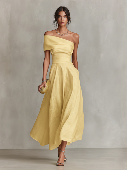 Women's yellow one-shoulder linen dress with draped neckline and gathered skirt