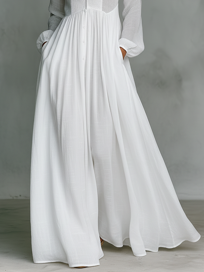 White cotton-linen maxi shirt dress with button front and pleated skirt detail