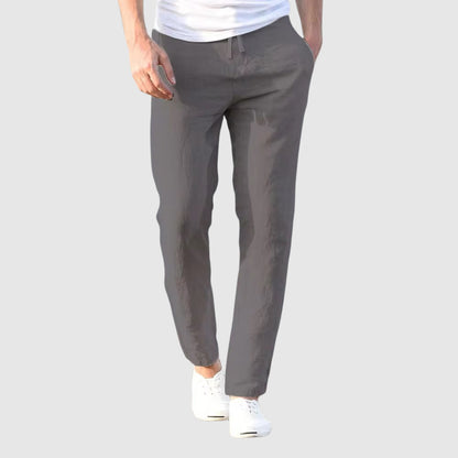 Gray lightweight linen pants with drawstring waist and tapered ankle-length legs