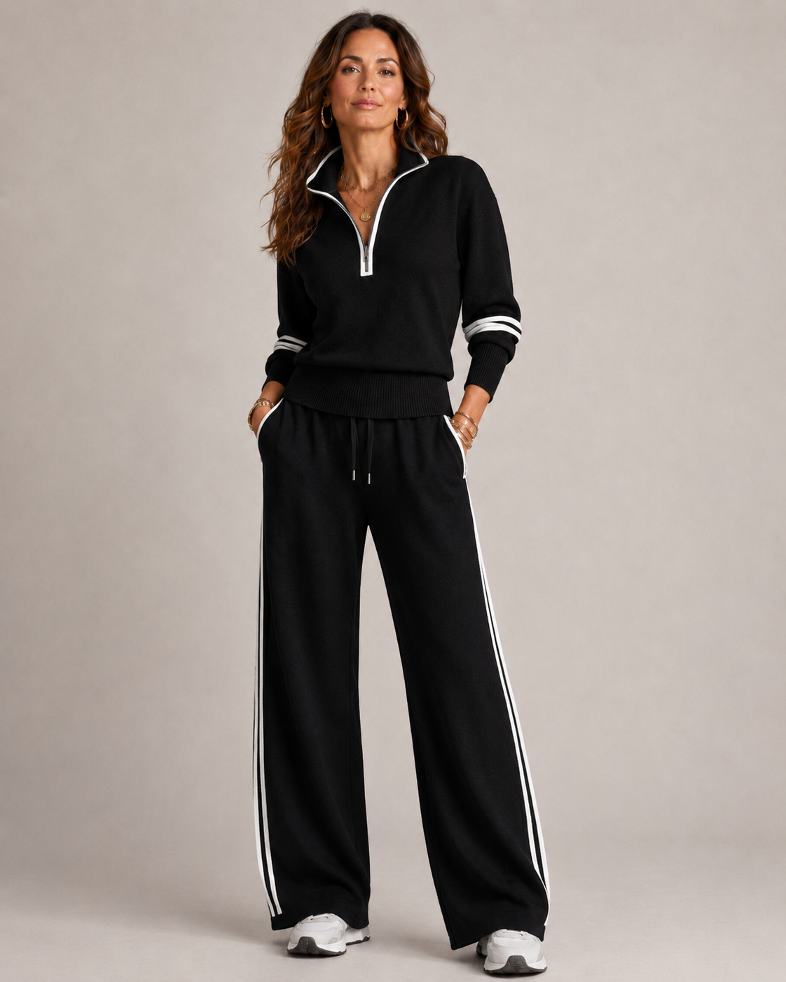 Women’s two-piece quarter-zip knit set, black top with striped wide-leg joggers