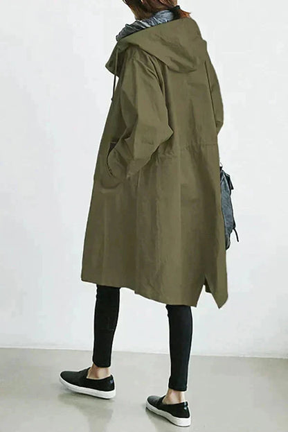 Women’s raincoat in green with oversized hood and button-front, long coat style.