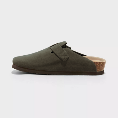 Green suede clog side view with adjustable buckle strap and textured sole edge