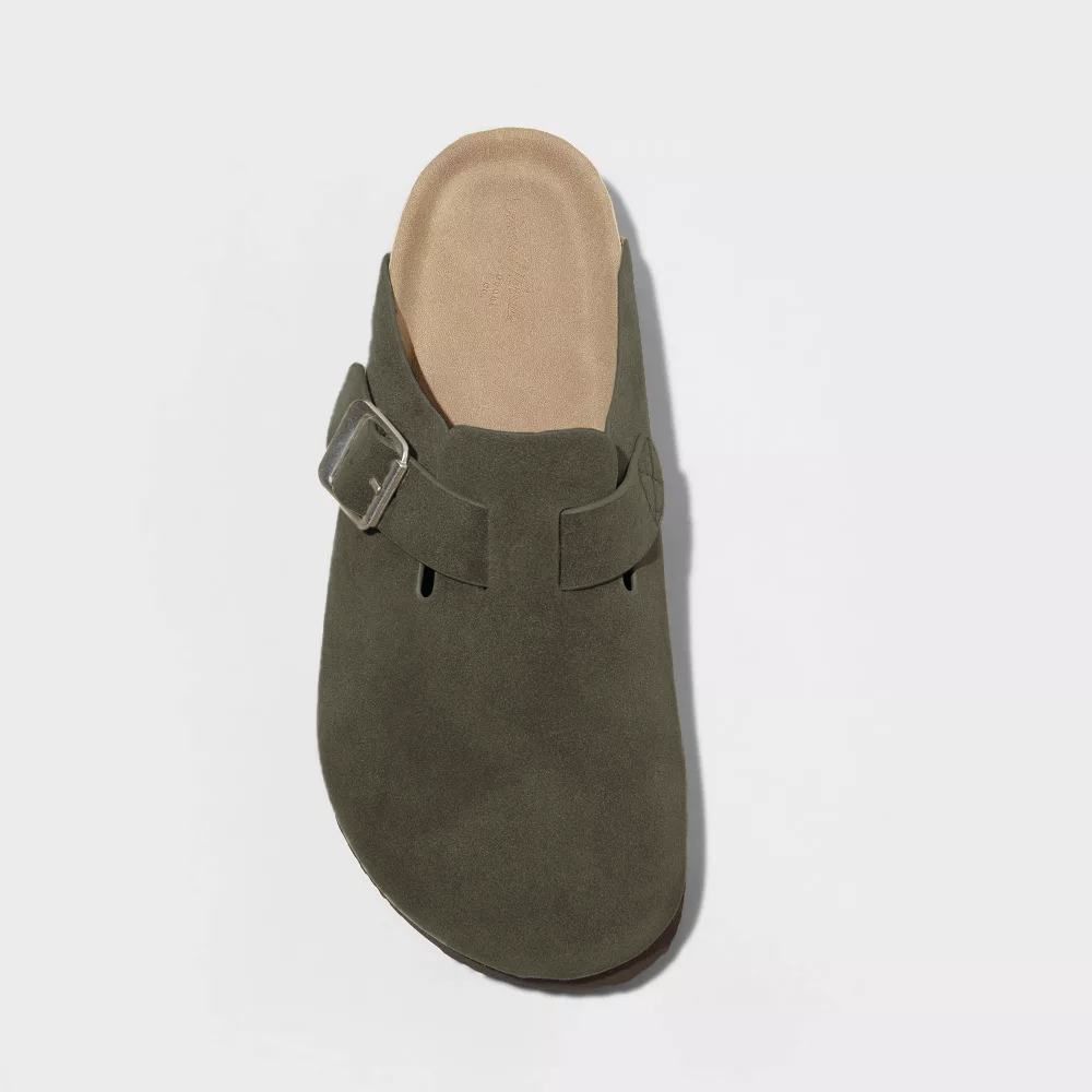 Green suede clog front view with adjustable buckle strap and tan insole