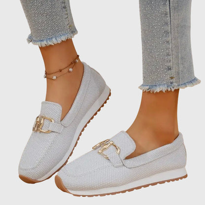 White textured ladies loafers with gold buckle detail and cushioned sole