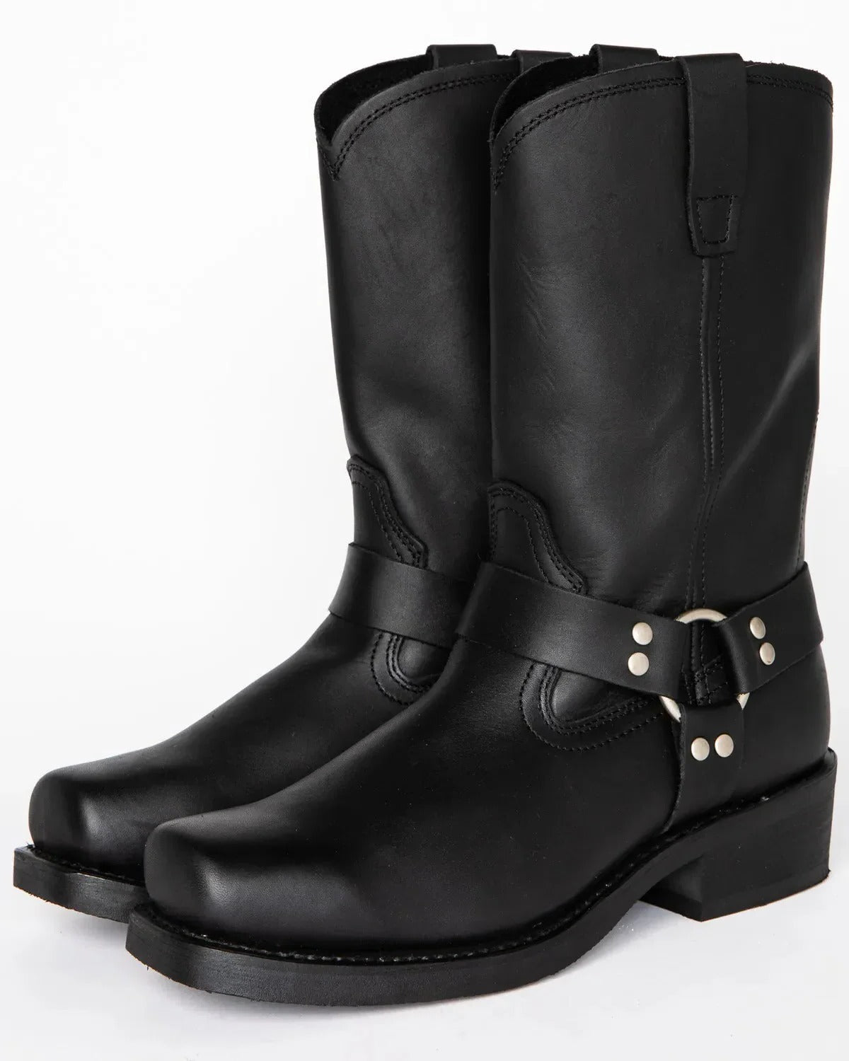 Men's black harness boots with ankle strap and metal studs, pair angled