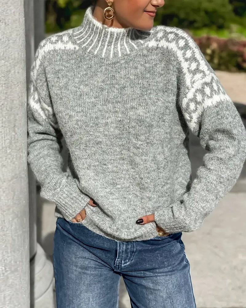 Grey knit jumper with ribbed high collar and patterned yoke; long sleeves