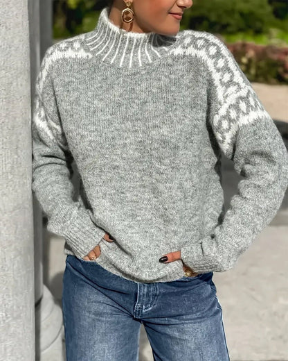 Grey knit jumper with ribbed high collar and patterned yoke; long sleeves