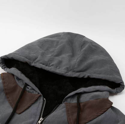 Gray hood lining and zipper edge, quilted jacket interior close-up