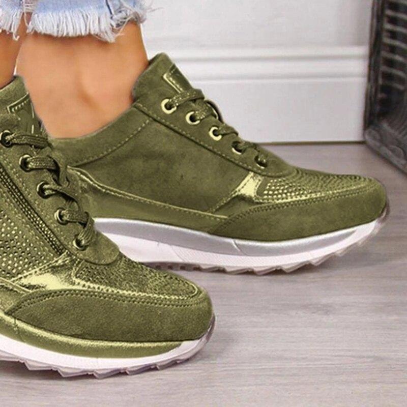 Olive green orthopaedic zip trainers close-up, lace-up front and textured panels