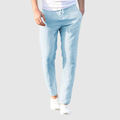 Light blue lightweight linen pants with drawstring waist and tapered ankle-length legs