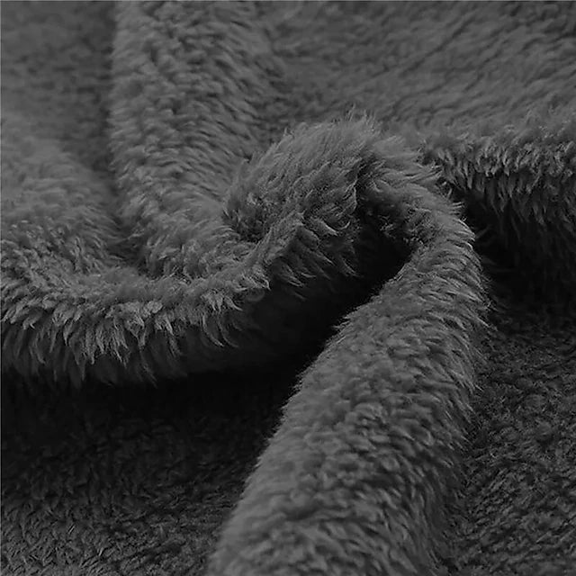 Black fleece fabric texture, plush hood lining close-up