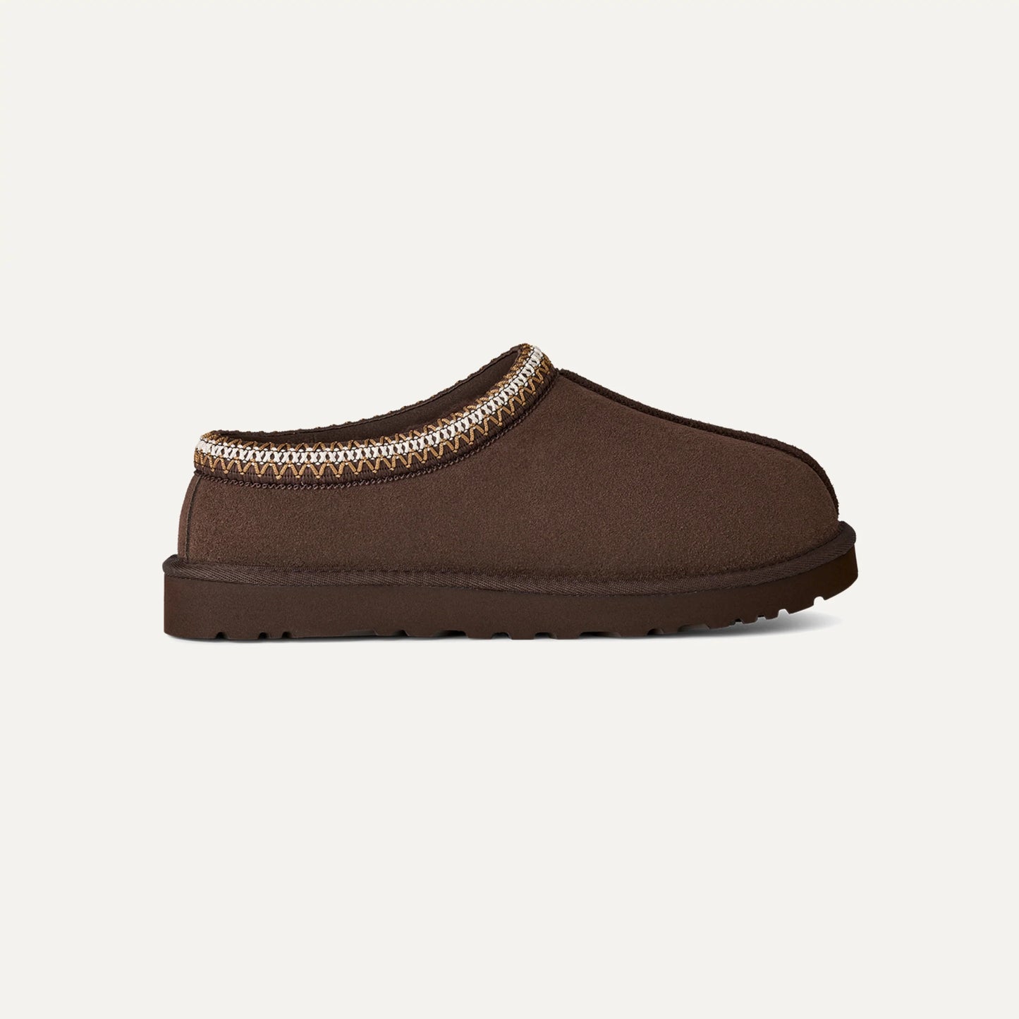 Chestnut brown suede slip-on slippers with patterned trim and low-profile sole