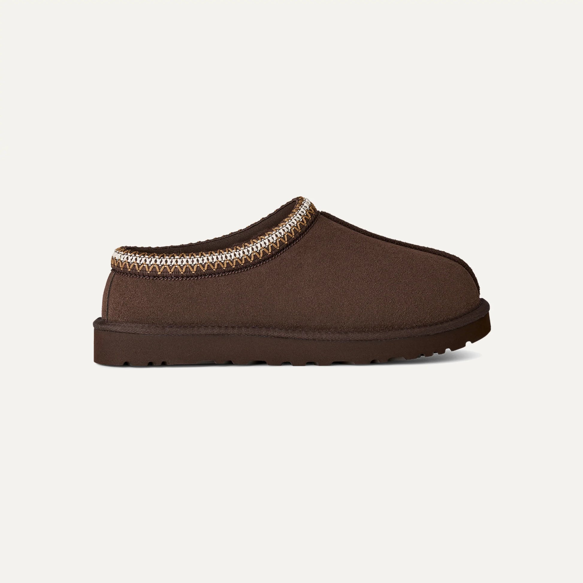Chestnut brown suede slip-on slippers with patterned trim and low-profile sole