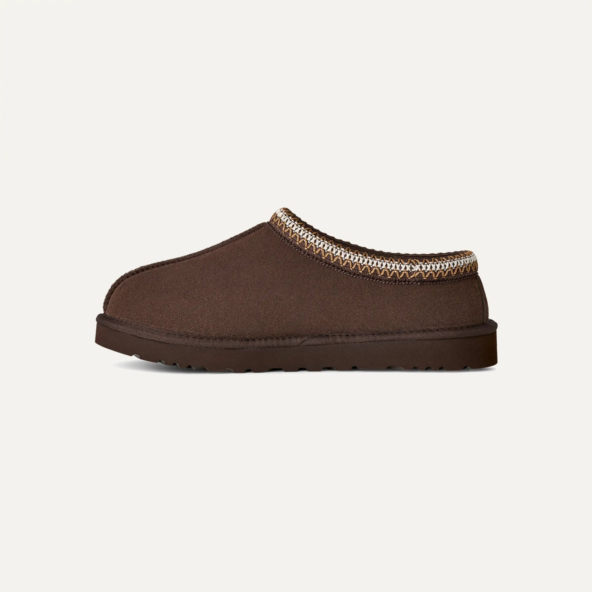 Chestnut brown suede slip-on slipper with patterned collar trim and rounded toe