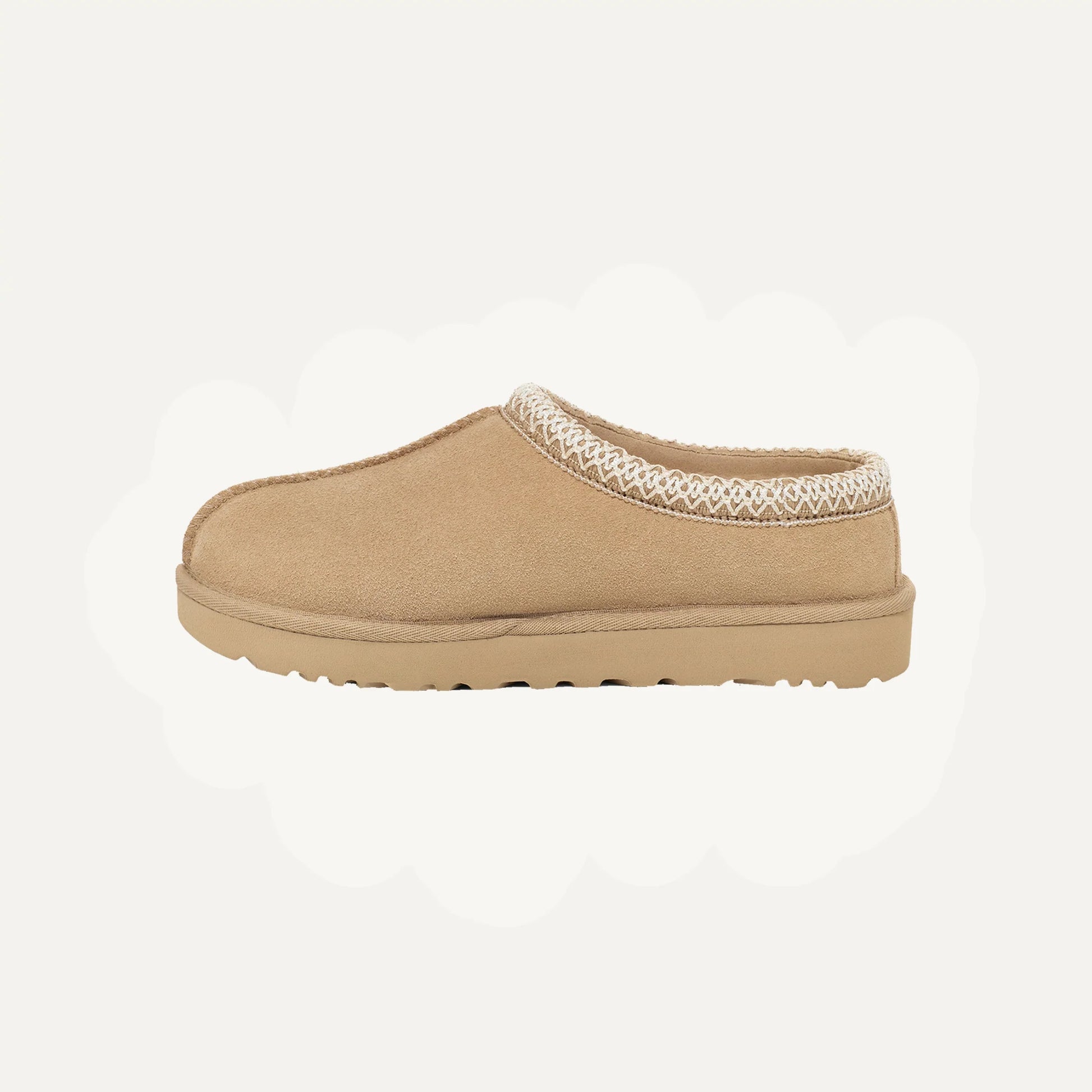 Mocha tan suede slip-on slippers with patterned collar trim and textured rubber sole