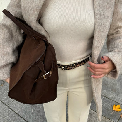 Dark brown suede crossbody-style handbag with metal ring strap attachment