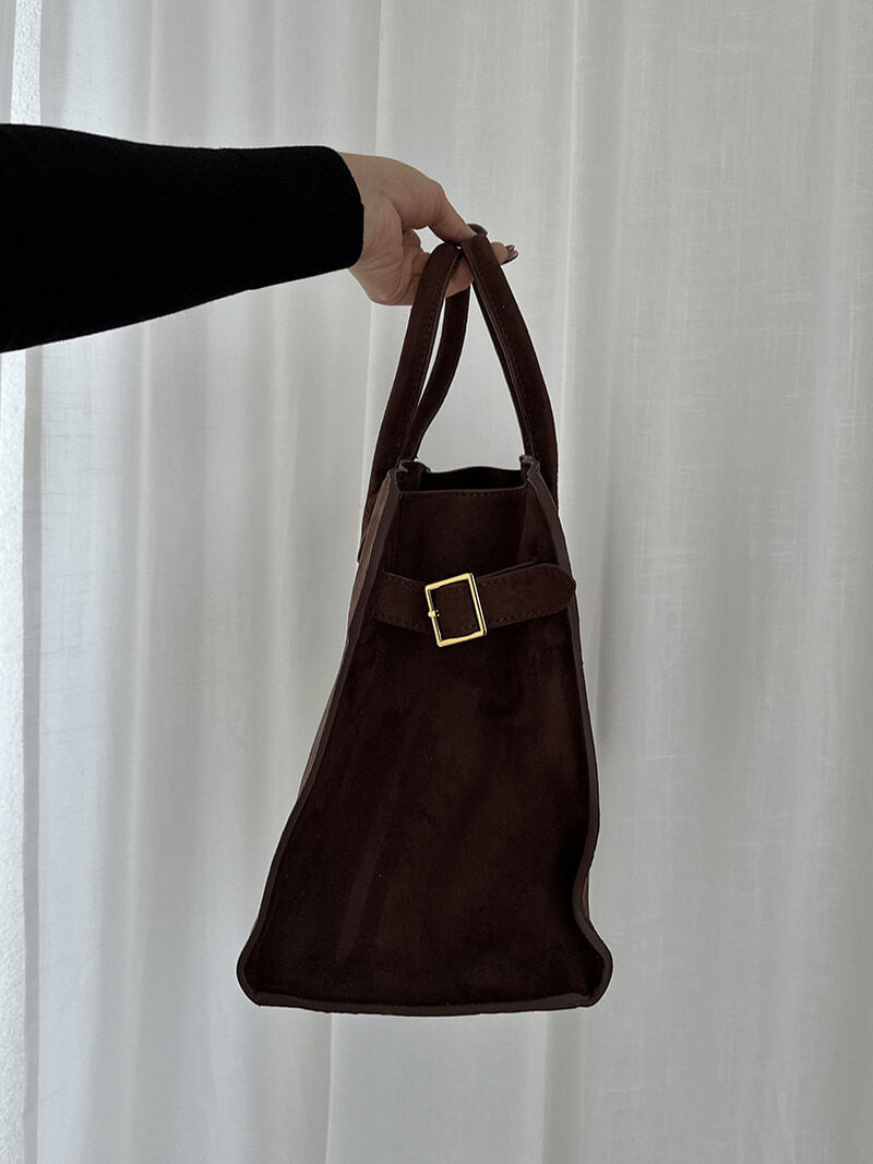 Dark brown suede mini handbag with top handle and square buckle front