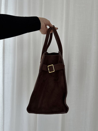 Dark brown suede mini handbag with top handle and square buckle front