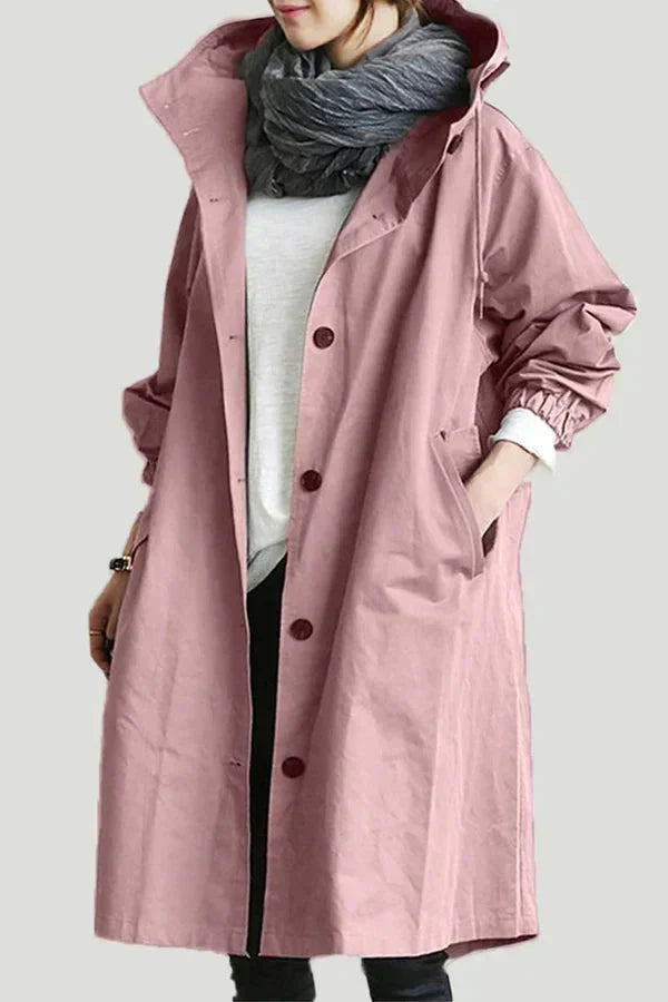 Women's waterproof raincoat with oversized hood, dusty pink color, button front