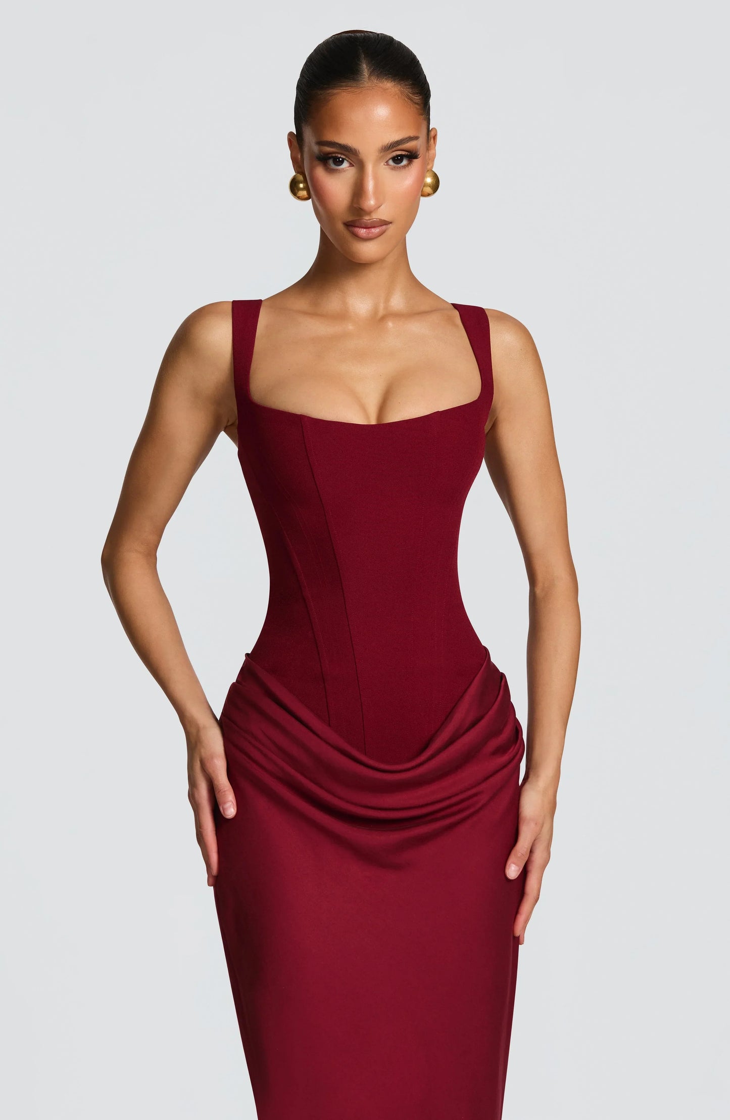 Burgundy bodycon maxi dress with spaghetti straps and ruched drape at waist