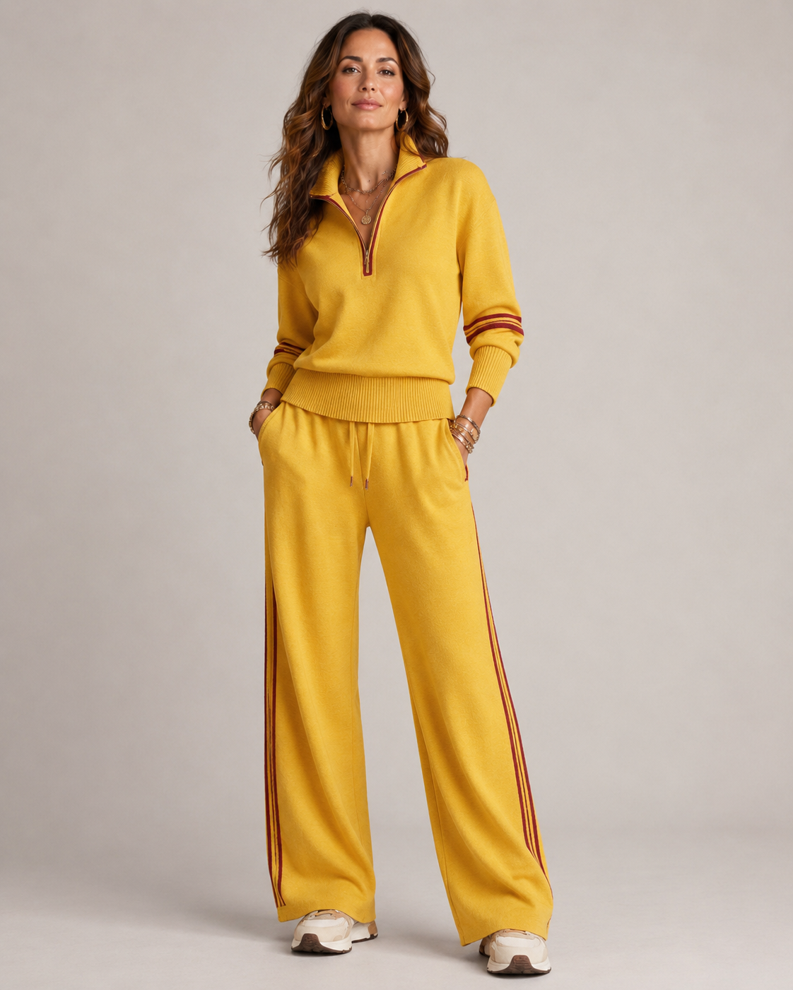 Women’s two-piece quarter-zip knit set, mustard yellow top with striped wide-leg joggers