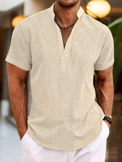 Men's beige khaki linen henley shirt with short sleeves and buttoned neckline.