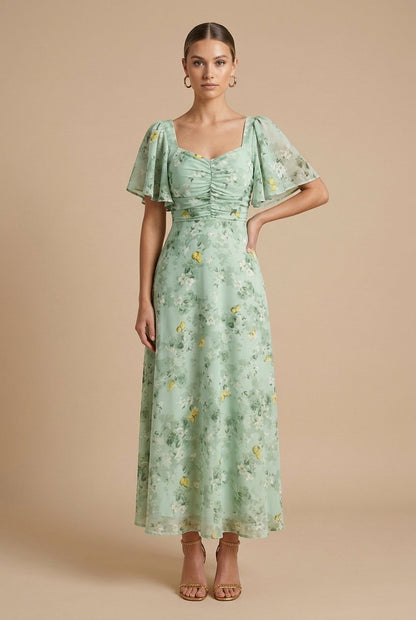Light green floral maxi dress with square neckline, ruched bodice and short puff sleeves