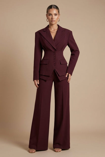 Wine red trouser suit: tailored blazer with wide-leg trousers, side front view