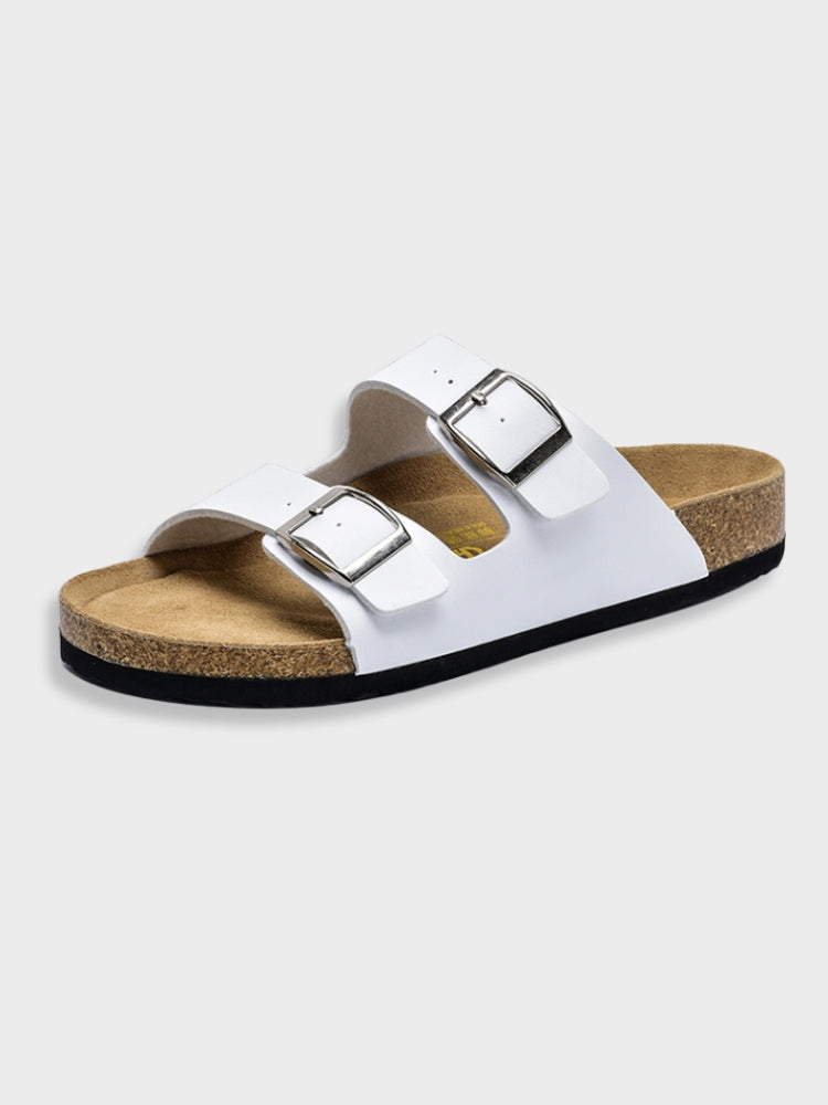 Women's footbed sandals in white with two square buckles and cork-textured sole.