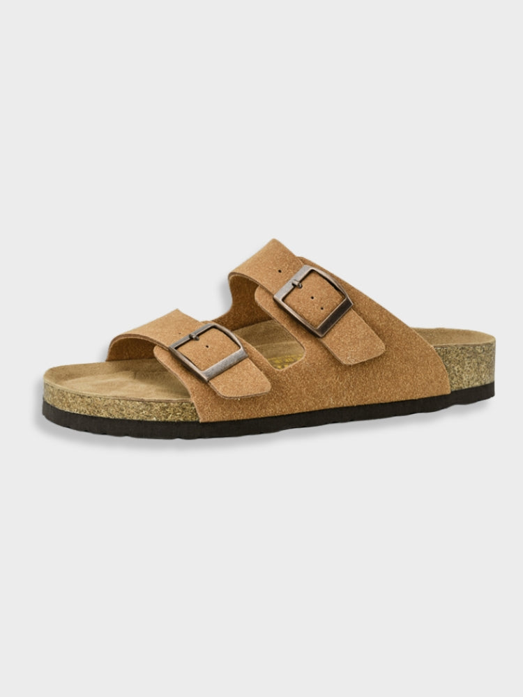 Women's footbed sandals in tan with two square buckles and cork-textured sole.